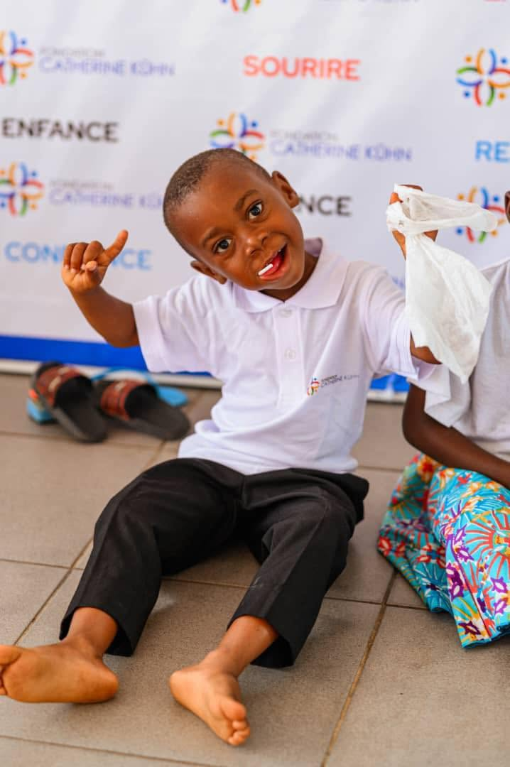 A smiling child at a Catherine Kühn Foundation celebration