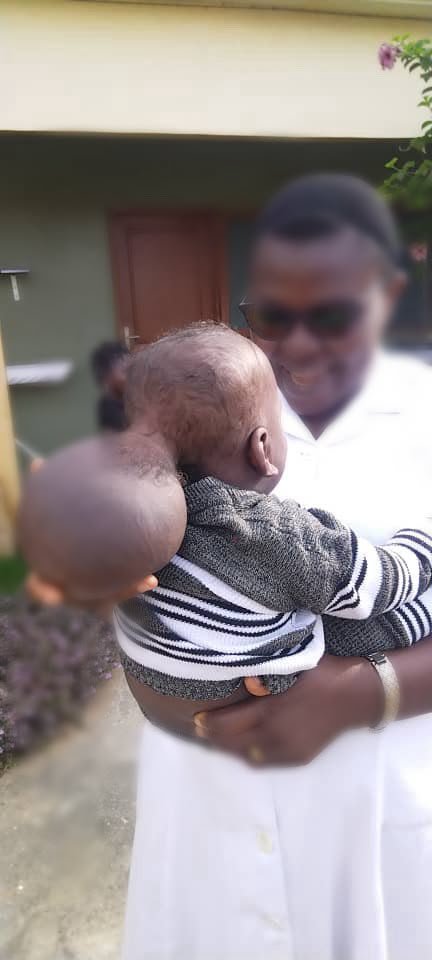 Manassé being held before his operation.