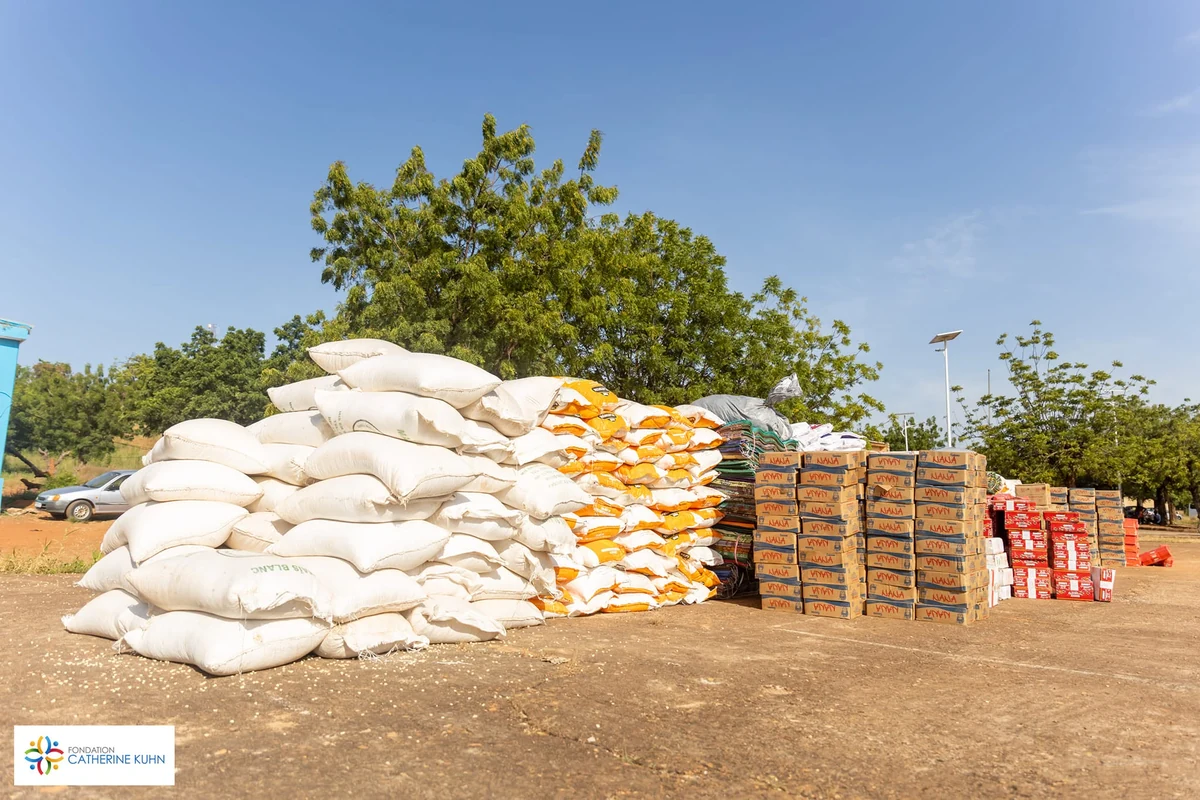 Bags and boxes of food supplies assembled outdoors